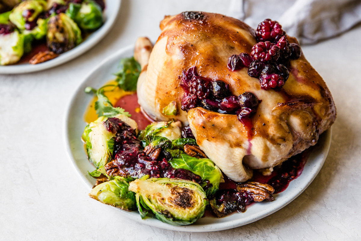 Blueberry sweet tea brined quail with raspberry barbecue sauce, black and blueberry hot sauce tossed brussels sprouts, strawberry oil and fresh cilantro. Sweet blueberry brine.