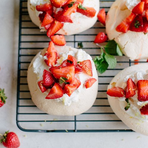 Mini Pavlovas with Whipped Cream & Macerated Strawberries